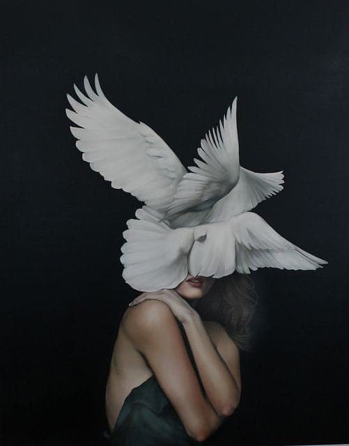 Girl covered with birds